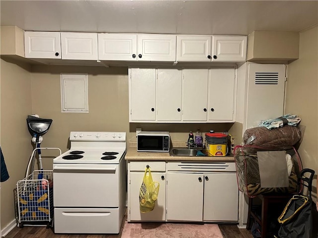 126 Park Ave, New Castle/2Nd, PA 16101 - kitchen featuring light countertops, white cabinetry, electric range, and wood finished floors