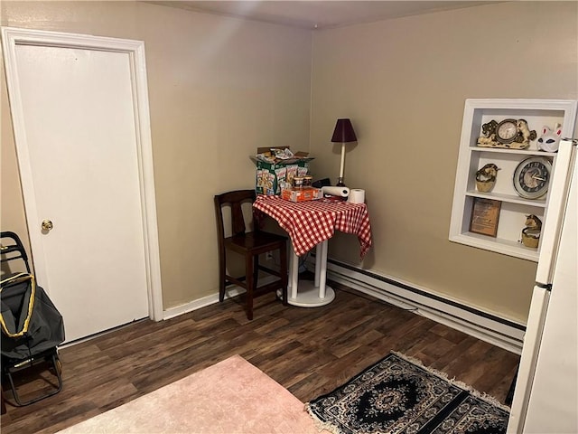 126 Park Ave, New Castle/2Nd, PA 16101 - dining space with dark wood-style flooring and a baseboard heating unit