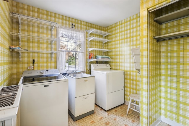 laundry room with independent washer and dryer