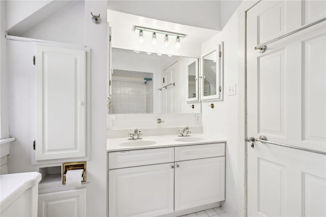 bathroom with tile patterned floors, vanity, and toilet