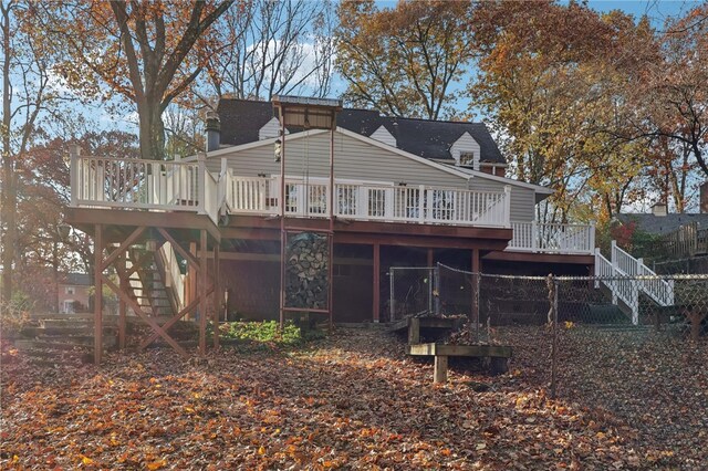 back of property with a wooden deck