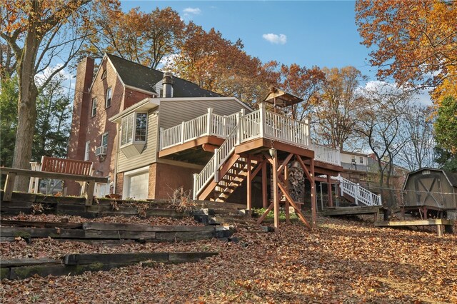 back of house with a wooden deck