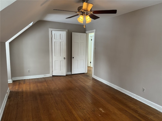 bonus room with ceiling fan, dark hardwood / wood-style flooring, and vaulted ceiling