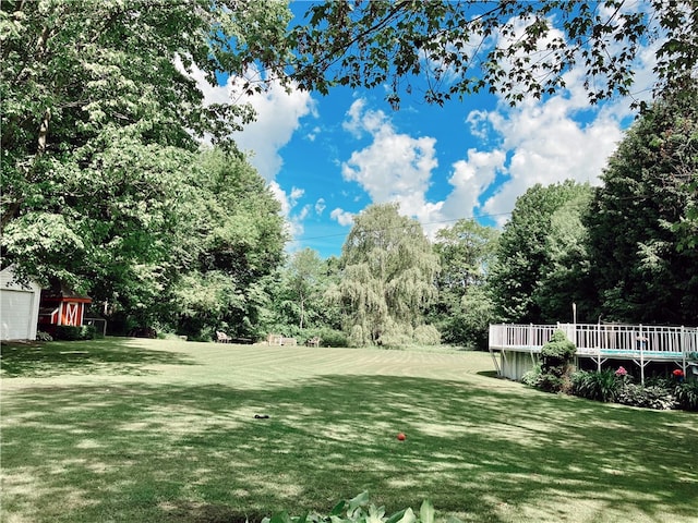 view of yard with a wooden deck