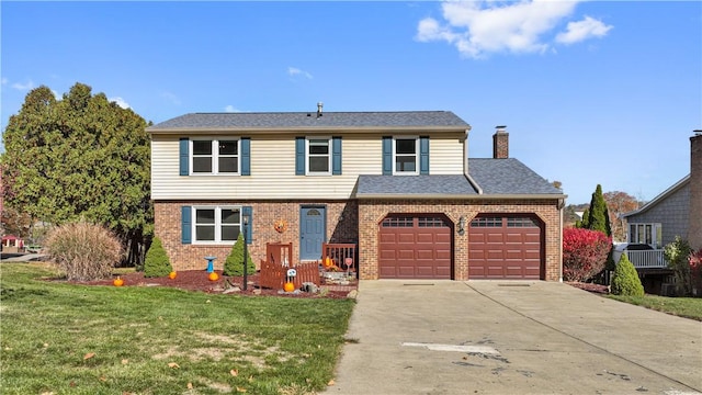 view of property with a front yard and a garage