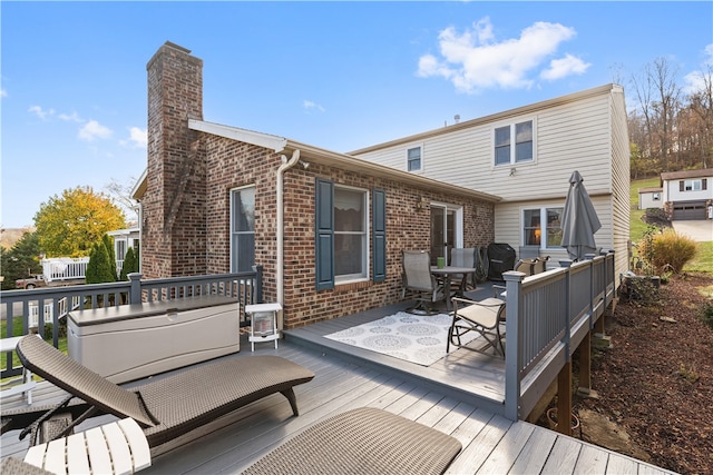 rear view of house featuring a deck