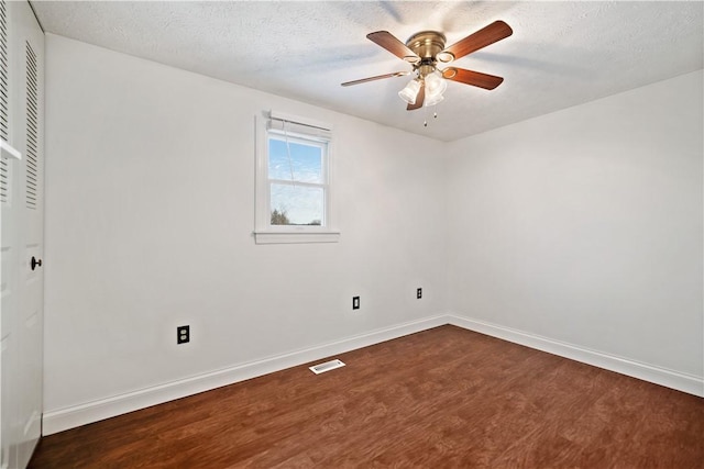 unfurnished room featuring hardwood / wood-style flooring, ceiling fan, and a textured ceiling