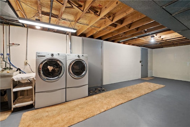 laundry area featuring sink and washing machine and clothes dryer