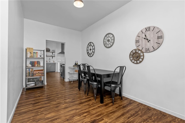 dining area featuring dark hardwood / wood-style floors and sink