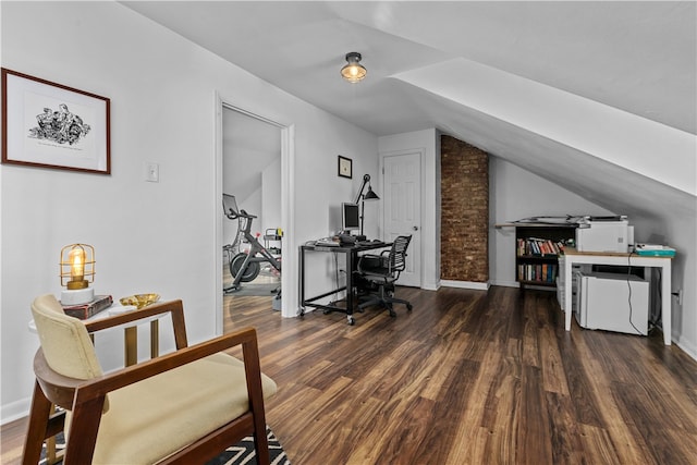 office space featuring dark hardwood / wood-style floors and vaulted ceiling