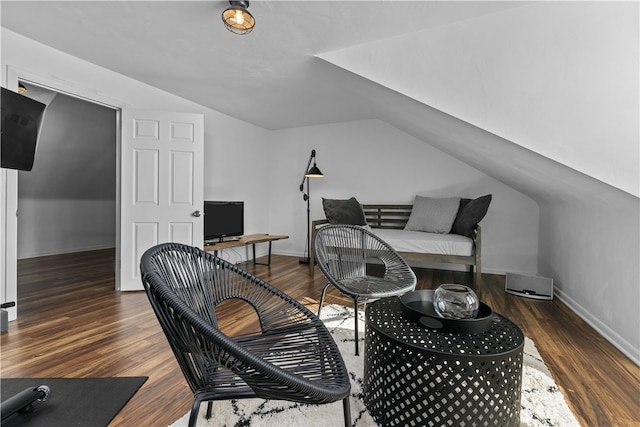 home office featuring dark hardwood / wood-style flooring and lofted ceiling