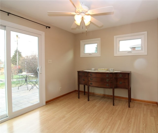 doorway to outside featuring ceiling fan and light wood-type flooring