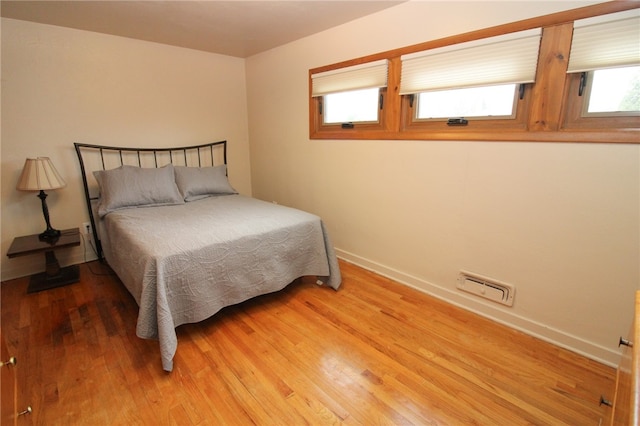 bedroom featuring wood-type flooring