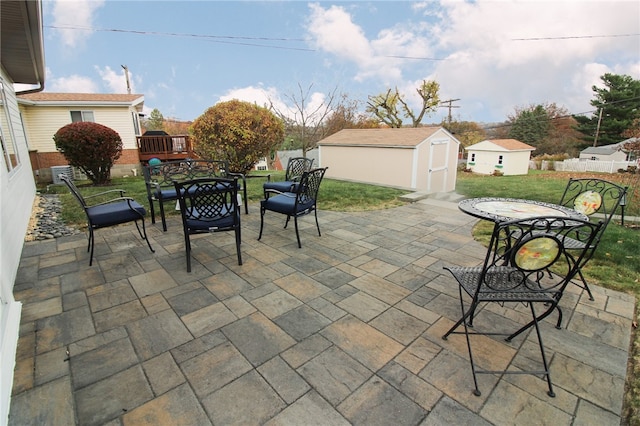 view of patio with a shed