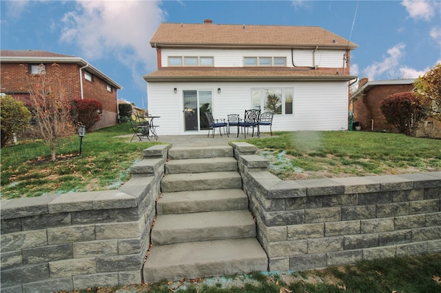 back of house with a patio