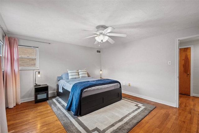 bedroom featuring hardwood / wood-style flooring and ceiling fan