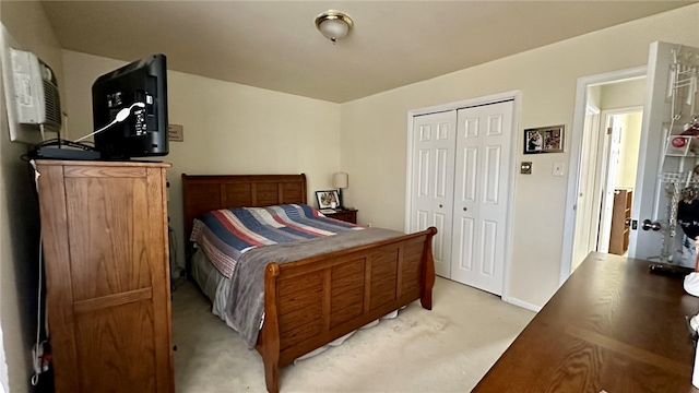 carpeted bedroom with a closet