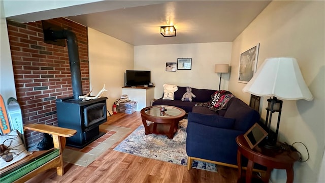 living room with light wood-type flooring and a wood stove