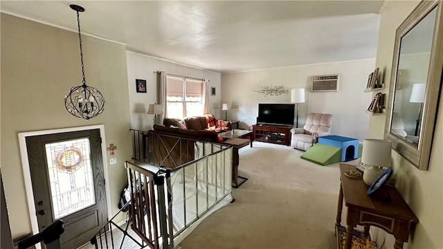 living room featuring a wall mounted air conditioner, carpet, and a chandelier