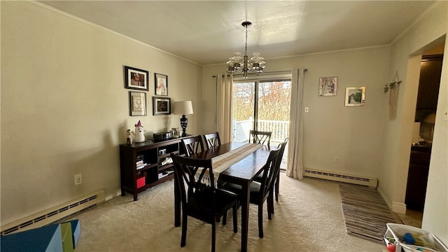 carpeted dining space with an inviting chandelier, crown molding, and a baseboard heating unit