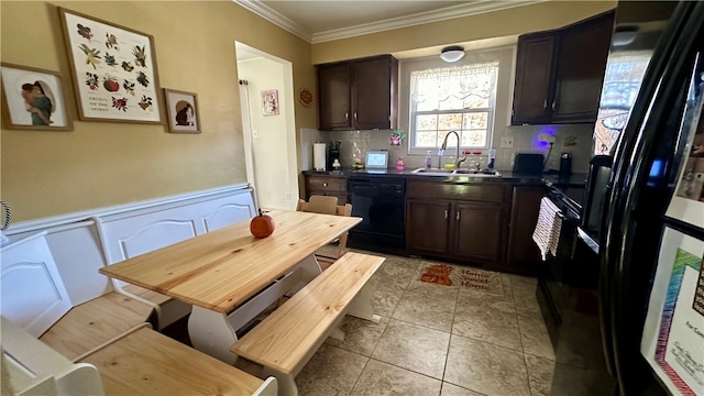 kitchen with tasteful backsplash, dark brown cabinetry, crown molding, black appliances, and sink