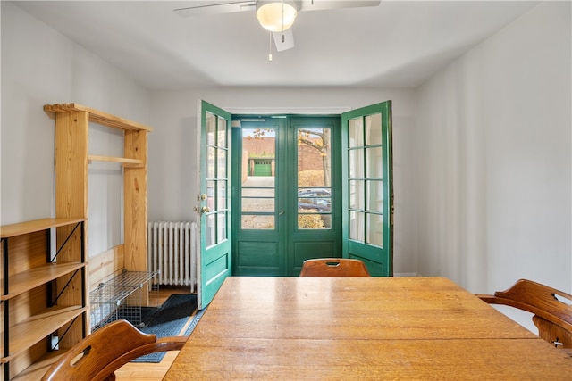 interior space featuring radiator, hardwood / wood-style flooring, and ceiling fan