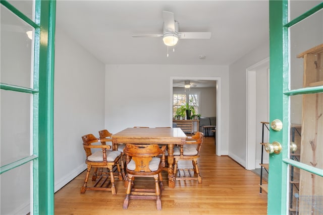 dining space featuring light wood-type flooring