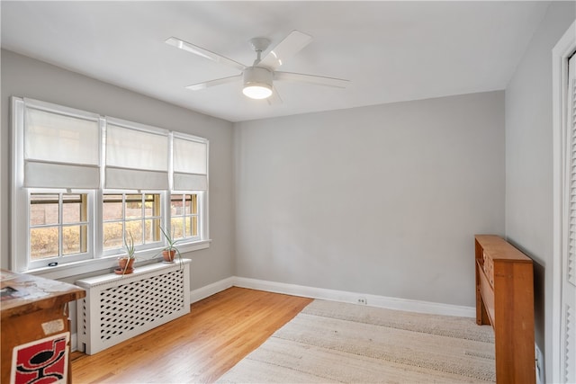 spare room with ceiling fan and light hardwood / wood-style flooring