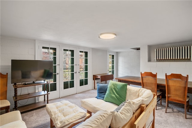 living room with french doors and light colored carpet