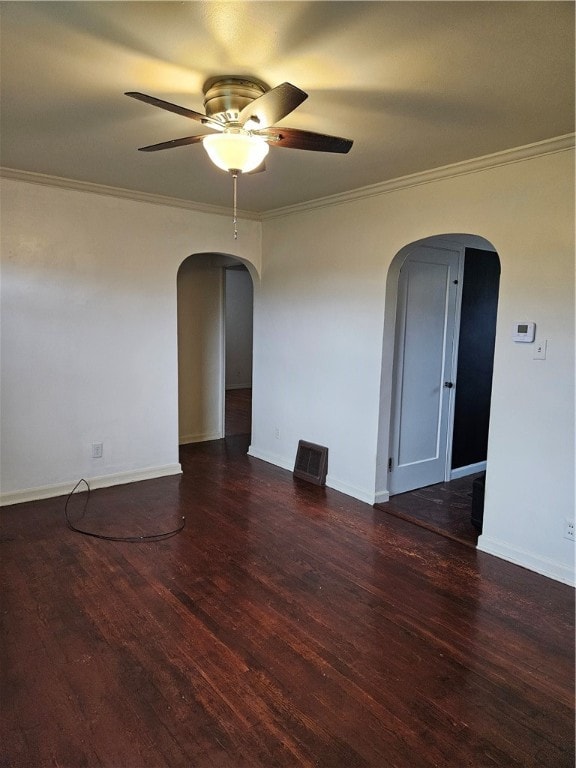 unfurnished room with ceiling fan, dark hardwood / wood-style floors, and ornamental molding