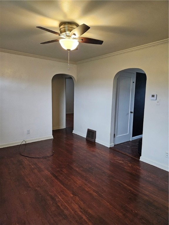 unfurnished room featuring ceiling fan, dark hardwood / wood-style flooring, and crown molding