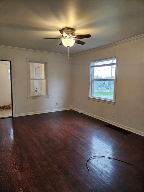 unfurnished room with ceiling fan, crown molding, and dark hardwood / wood-style floors