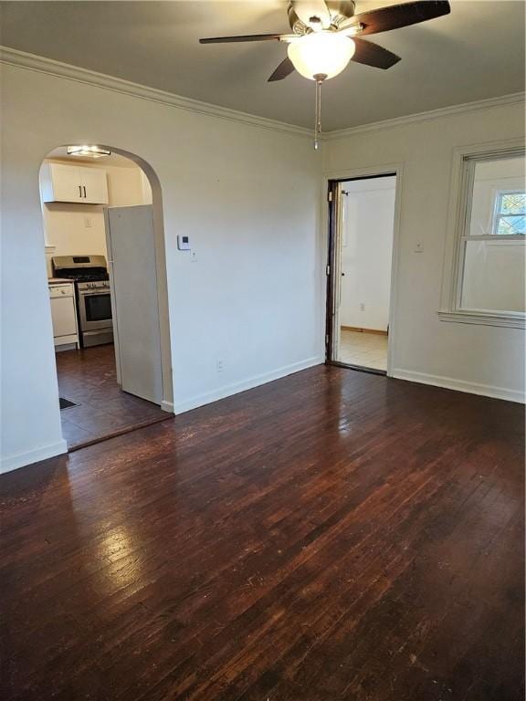 empty room featuring ceiling fan, dark hardwood / wood-style flooring, and ornamental molding