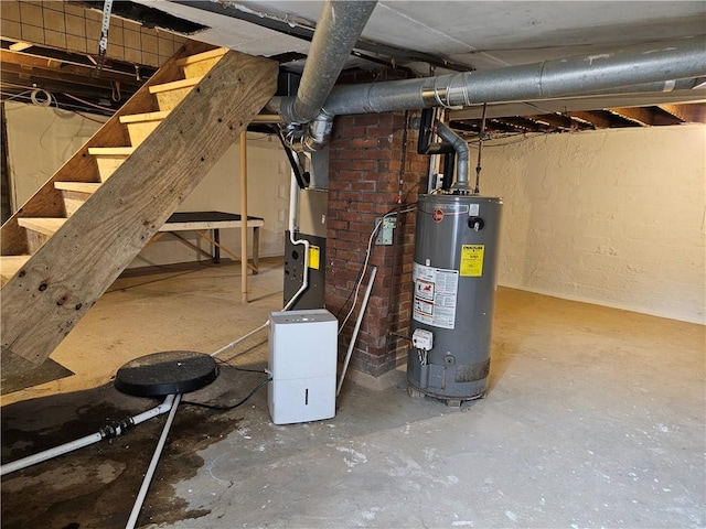 utility room featuring gas water heater