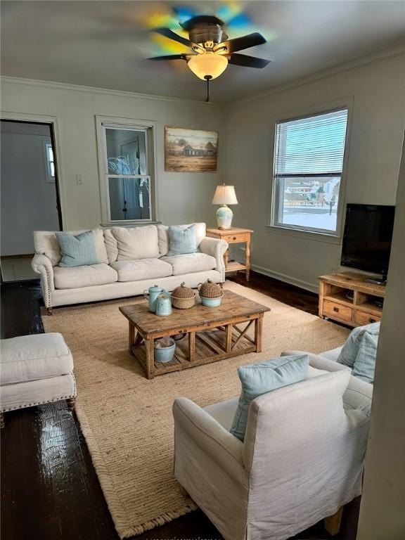 living room featuring ceiling fan, hardwood / wood-style flooring, and ornamental molding