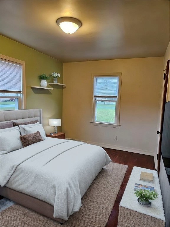 bedroom featuring dark hardwood / wood-style flooring