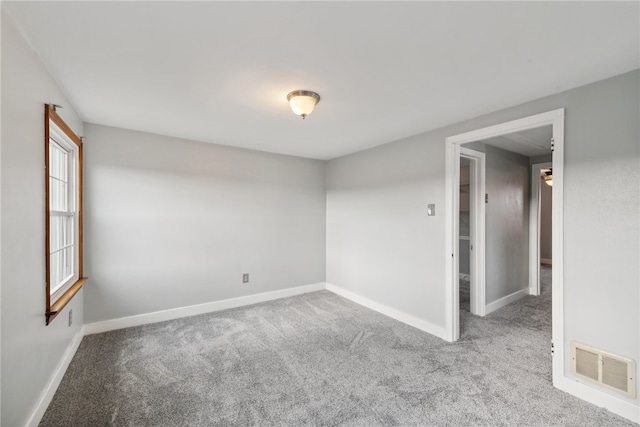 unfurnished room featuring carpet floors