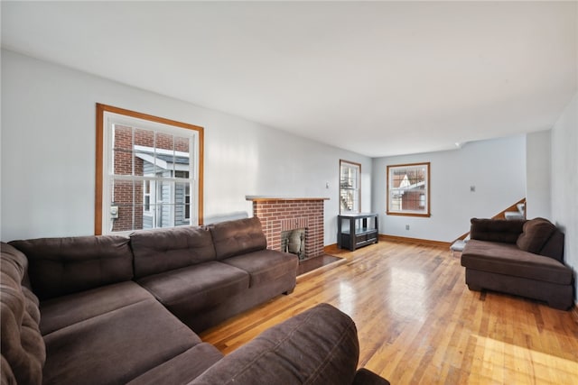 living room with a fireplace and light hardwood / wood-style floors