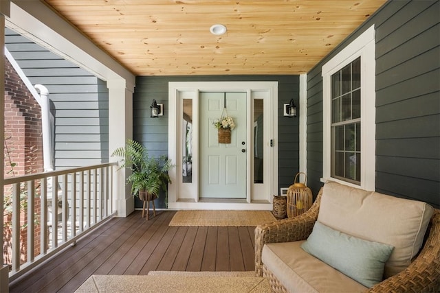 view of exterior entry with covered porch