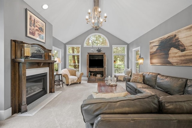 living room featuring high vaulted ceiling, an inviting chandelier, and light colored carpet