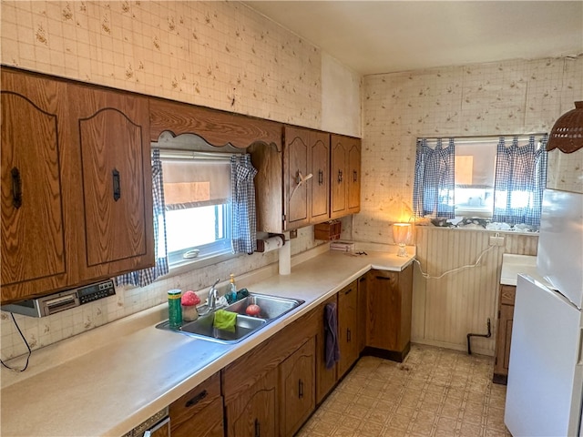 kitchen featuring sink and white refrigerator