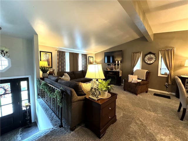 living room featuring carpet and vaulted ceiling with beams