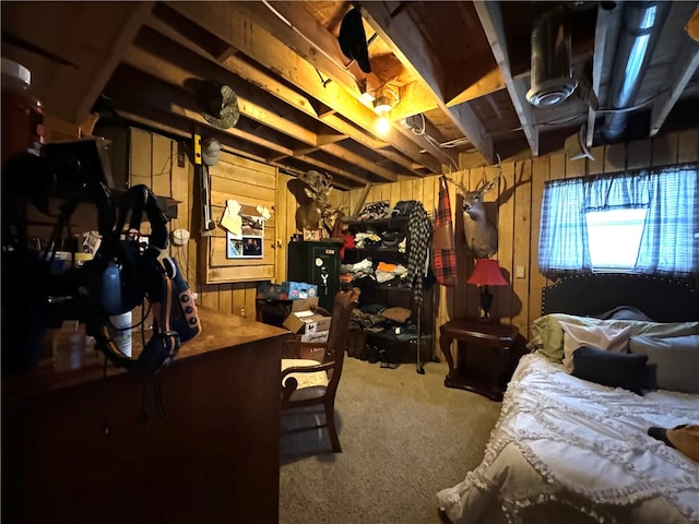 bedroom featuring wood walls and carpet floors