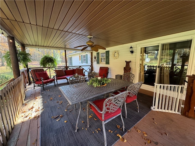 wooden terrace featuring ceiling fan