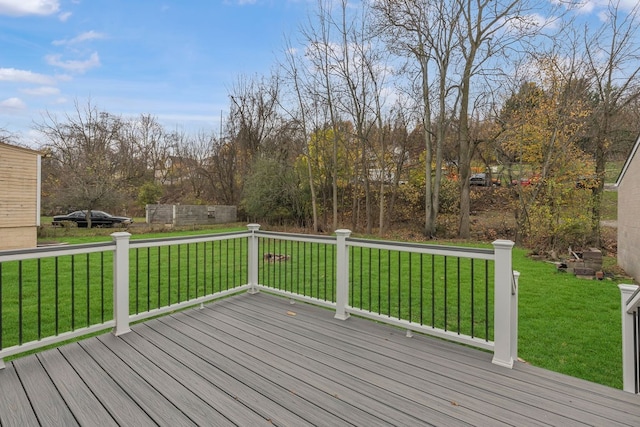 wooden terrace with a yard