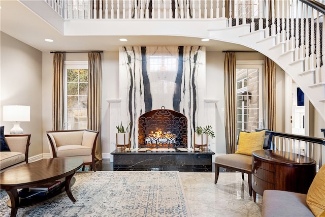 living area featuring a towering ceiling