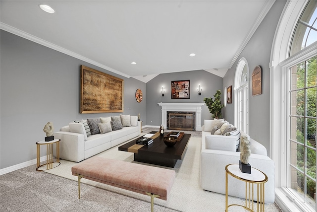 living room with ornamental molding, carpet, and lofted ceiling