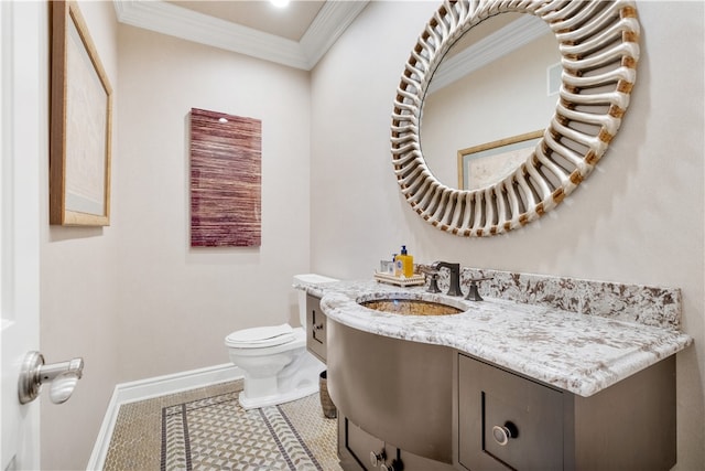 bathroom featuring tile patterned floors, vanity, toilet, and crown molding