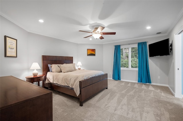 bedroom featuring light carpet, ceiling fan, and crown molding