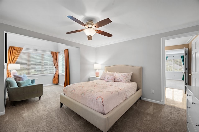 bedroom featuring crown molding, ceiling fan, and carpet floors